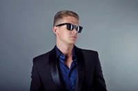 Stylish Gentleman in Tuxedo with Sunglasses