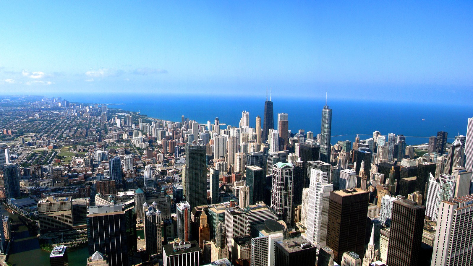 Vista arafed de uma cidade com um lago e um corpo d'água (chicago, cidade, paisagem urbana, área urbana, metrópole)