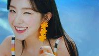 Irene from Red Velvet smiling brightly with floral earrings at The Reve Festival Day 2.