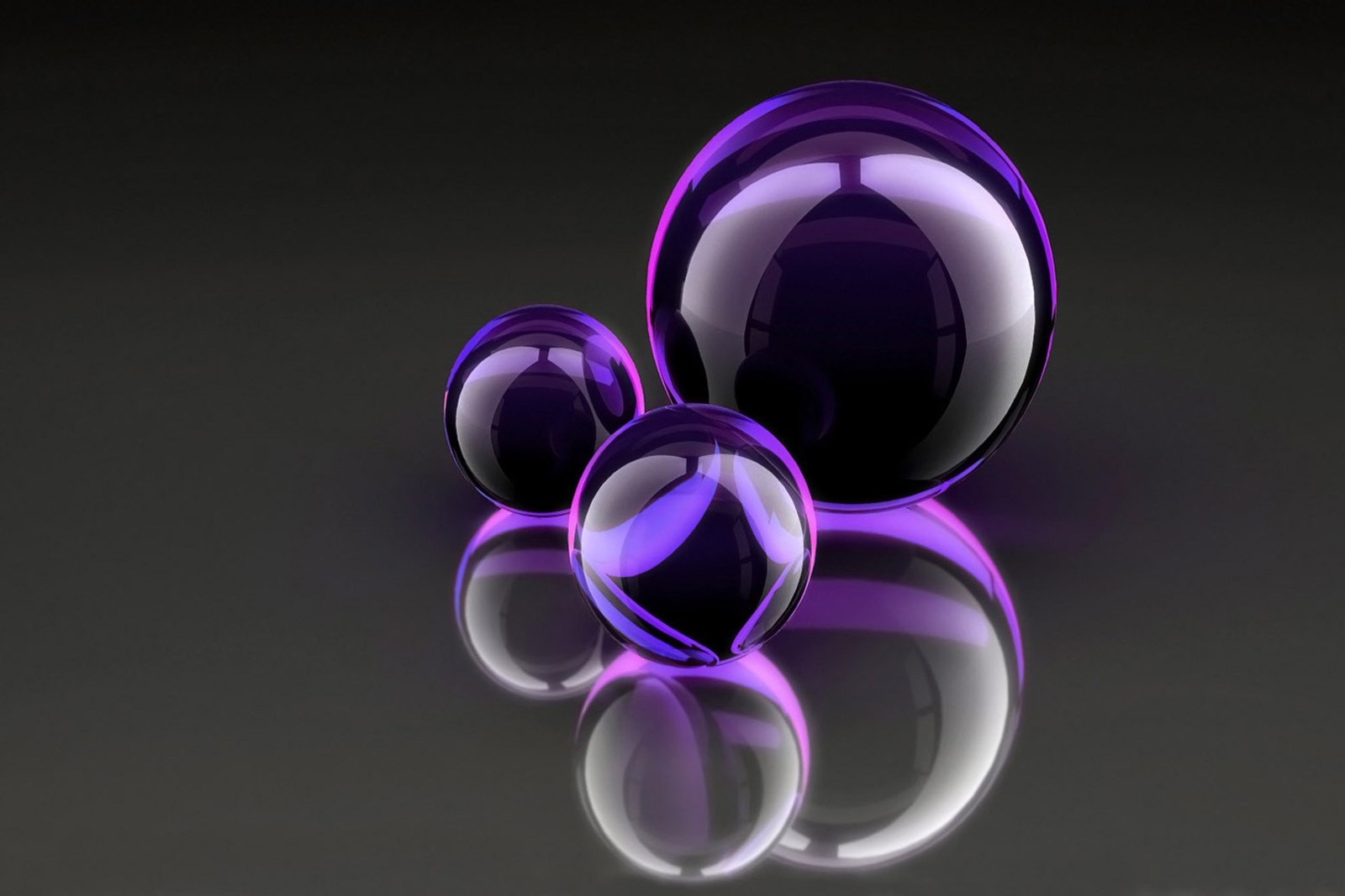 Purple glass spheres on a black surface with a reflection (abstract, purple balls)