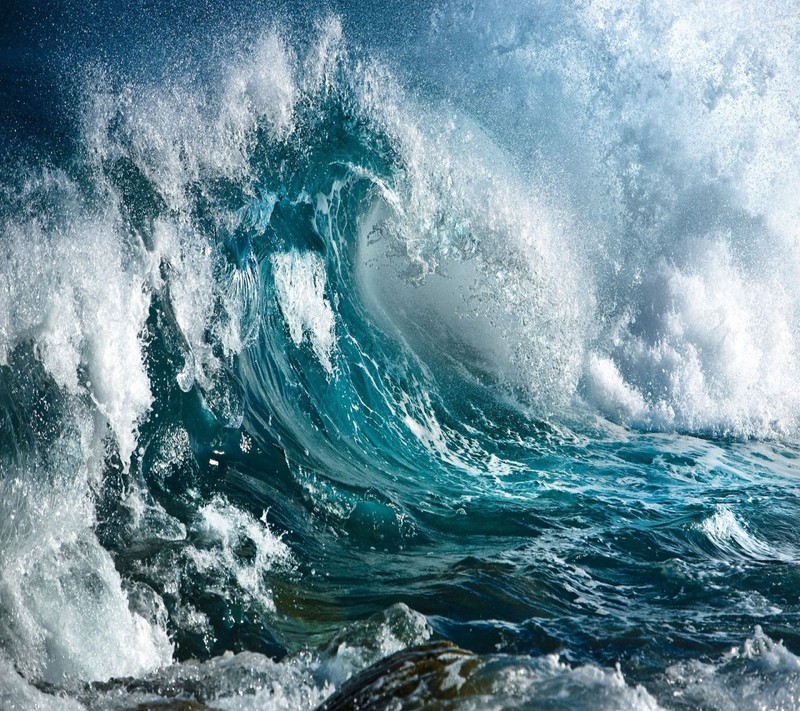 Arafed view of a large wave breaking on a rocky shore (wallpaper, wave)