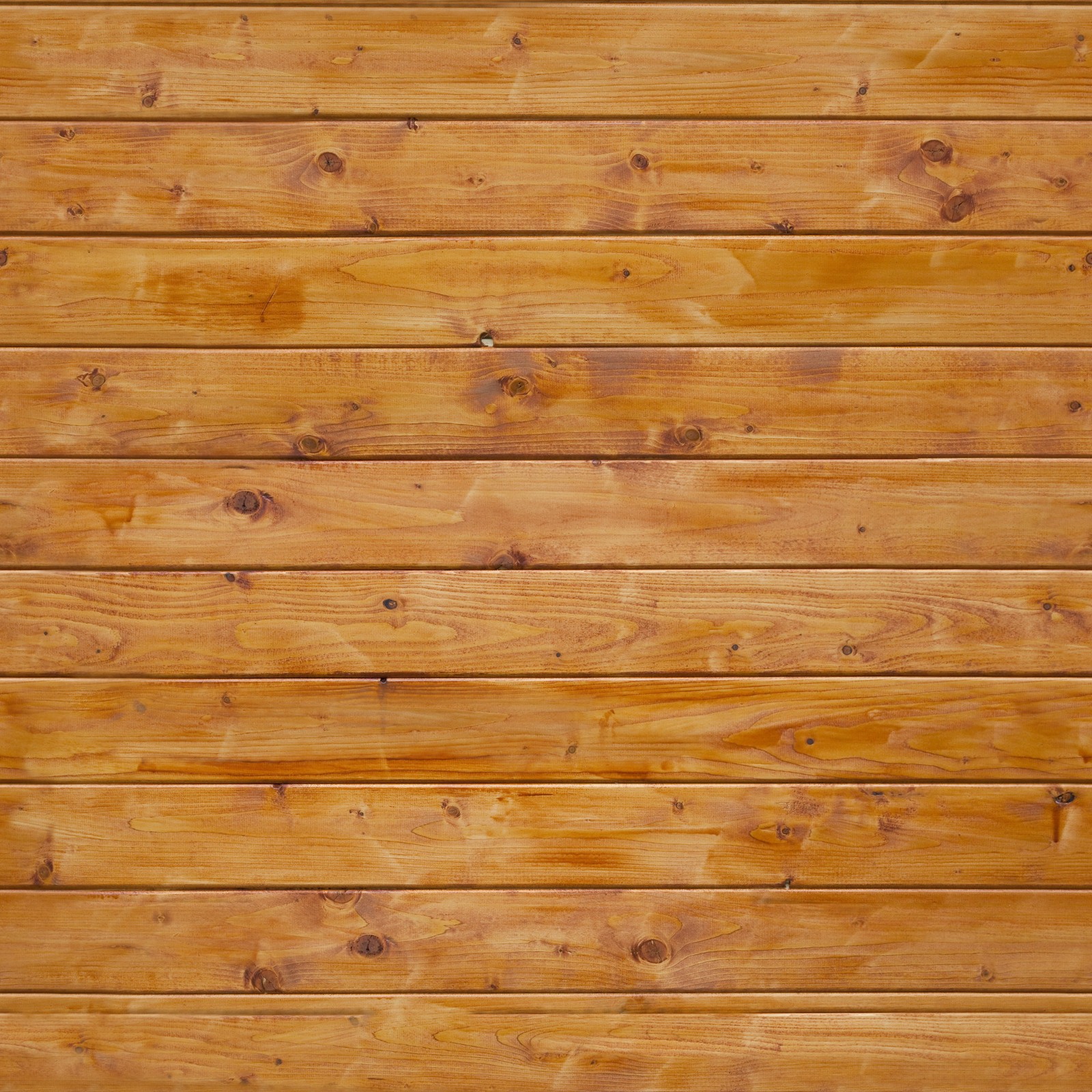 Un primer plano de una pared de madera con una mancha marrón (tabla, madera, piso de madera, tinte para madera, madera dura)