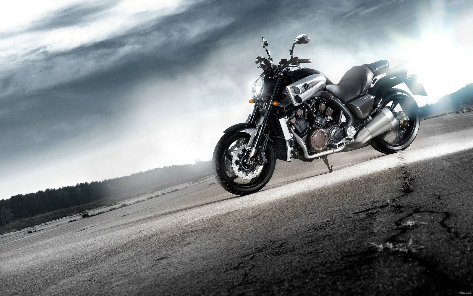 Arafed motorcycle parked on a road with a cloudy sky in the background (yamaha vmax, yamaha motor company, motorcycle, cruiser, motorcycling)