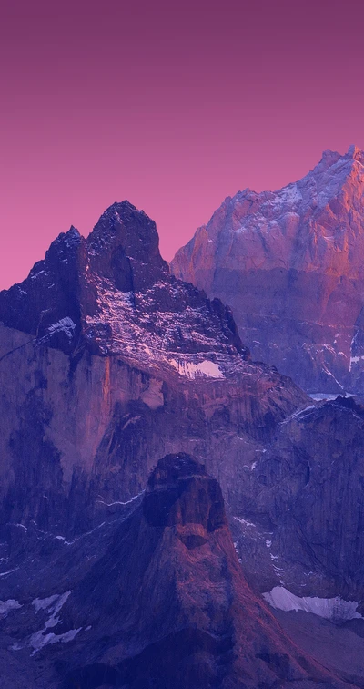 Stunning mountain landscape in Torres del Paine National Park at sunset, showcasing rugged geological formations and vibrant colors.