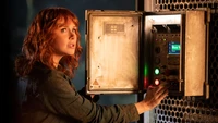 Bryce Dallas Howard operating a control panel in Jurassic World Dominion.