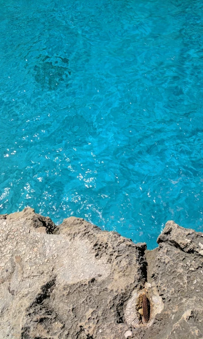 Crystal Clear Waters of Sardinia's Rocky Coastline