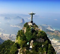 Christ the Redeemer overlooking the mountains and coastline of Brazil.