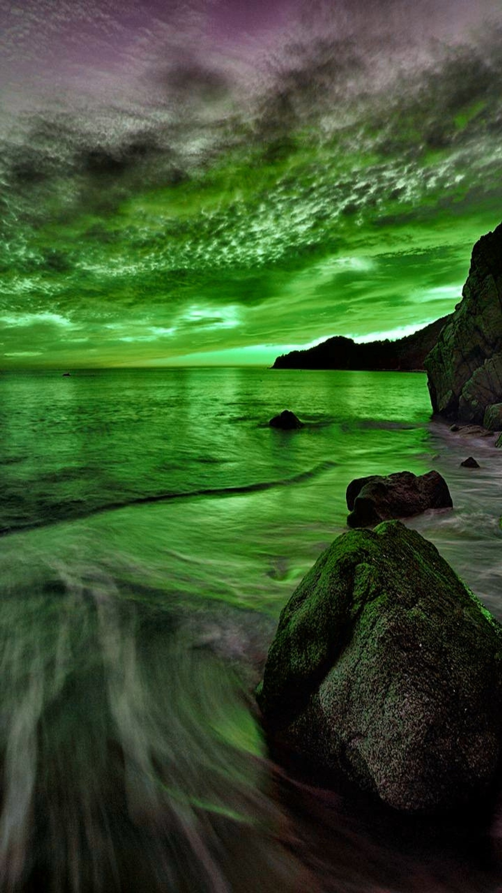 Arafed view of a green sky over a body of water (green, horizon)