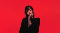 Anime Girl with Intricate Tattoos Against a Red Background