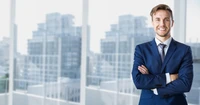 Confident Businessperson in Formal Attire Against Urban Skyline.