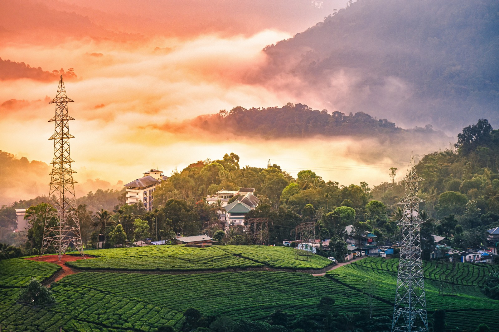 Uma vista de uma aldeia no meio de um vale verdejante (natureza, cenário de montanha, munnar, estação de montanha, área rural)