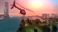 Skyline von Vice City bei Sonnenuntergang: Eine Sicht aus dem Hubschrauber über eine Metropole