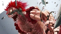 Eijiro Kirishima se transforma en Red Riot, mostrando su formidable forma blindada en medio de una explosión dinámica de escombros.