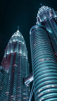 Illuminated Symmetry of Iconic Skyscrapers at Night