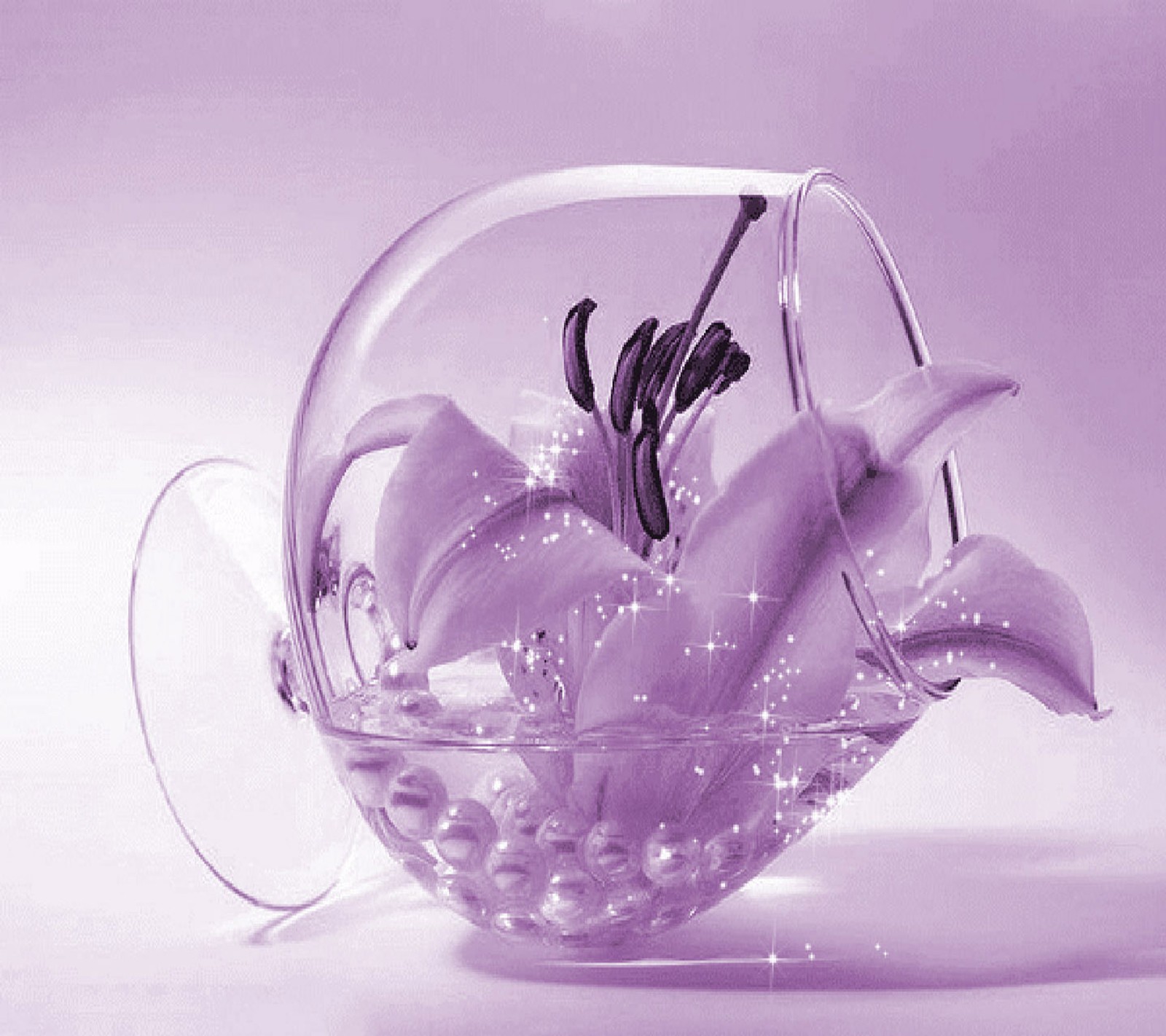 There is a glass vase with flowers inside of it (beautiful, flower)