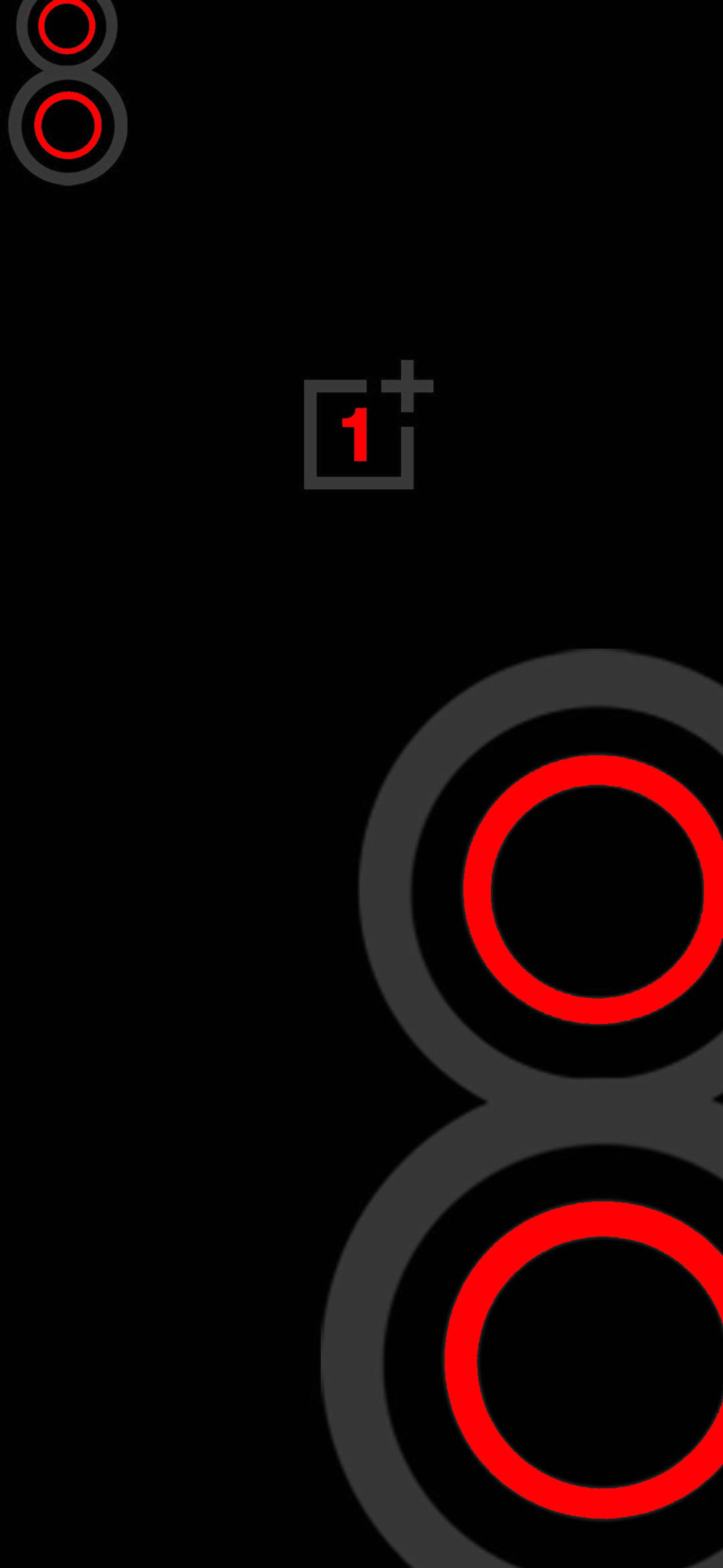 Un primer plano de un número rojo y negro sobre un fondo negro (amoled, oscuro, iphone, logotipo, nunca te conformes)