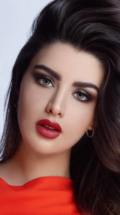 Kuwaiti Beauty: Striking Features with Blue Eyes and Red Lips