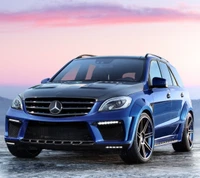 Sleek Blue Mercedes-Benz SUV Against a Serene Sunset Background