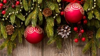 Festive Christmas Decor with Red Ornaments and Pine Cones