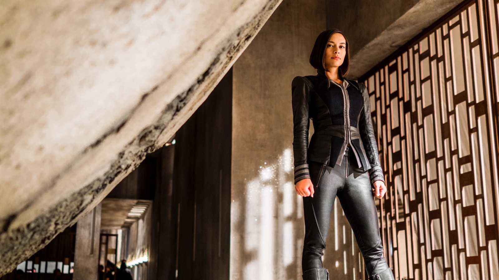 Arafed woman in black jacket and leather pants standing in a room (crystal, marvel cinematic universe, marvel comics, superhero, eyewear)