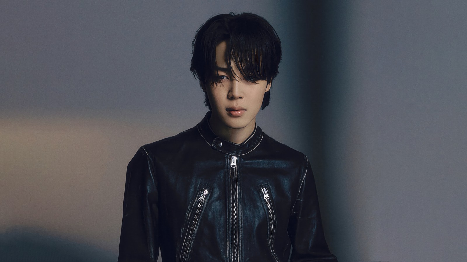 Araffed young man in a black leather jacket and jeans (jimin, 지민, park ji min, 박지민, bts)