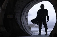 Din Djarin: The Mandalorian Silhouette in a Darkened Portal