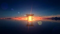 Serene Torii Gate Silhouetted Against a Vibrant Sunset Horizon