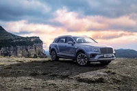 Luxury SUV Bentley Bentayga V8 Against a Scenic Mountain Backdrop