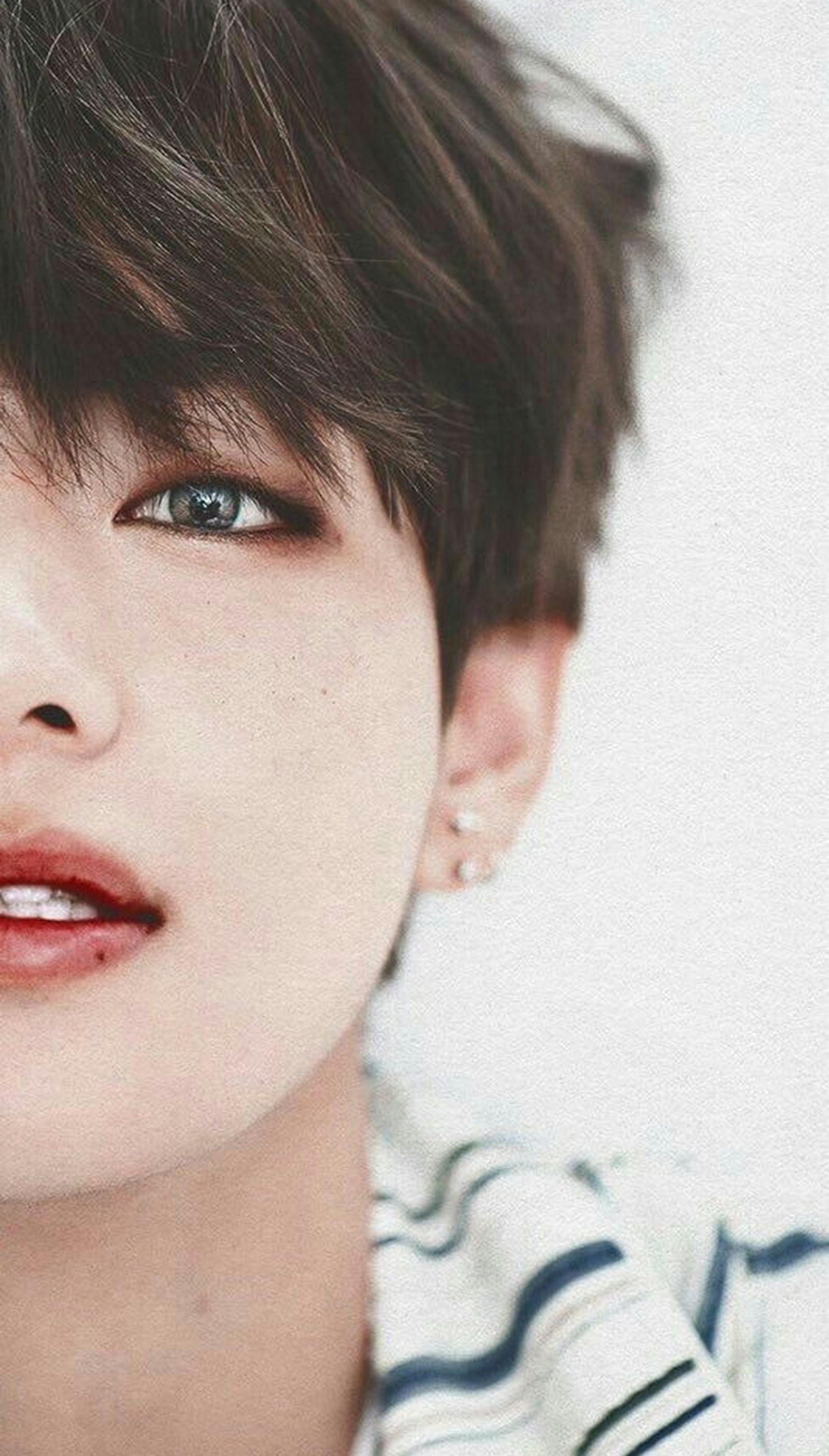 A close up of a person with a striped shirt and earrings (bts v, taehyung, bts, army, idol)