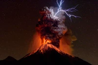 Majestic Eruption: Volcano with Lightning Illuminating the Night Sky