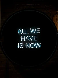 All We Have is Now: Neon Typography on Black Background