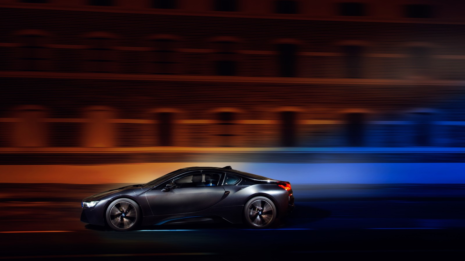 A black sports car driving on a city street at night (reflection, 2019 bmw i8, bmw i8, car, sports car)