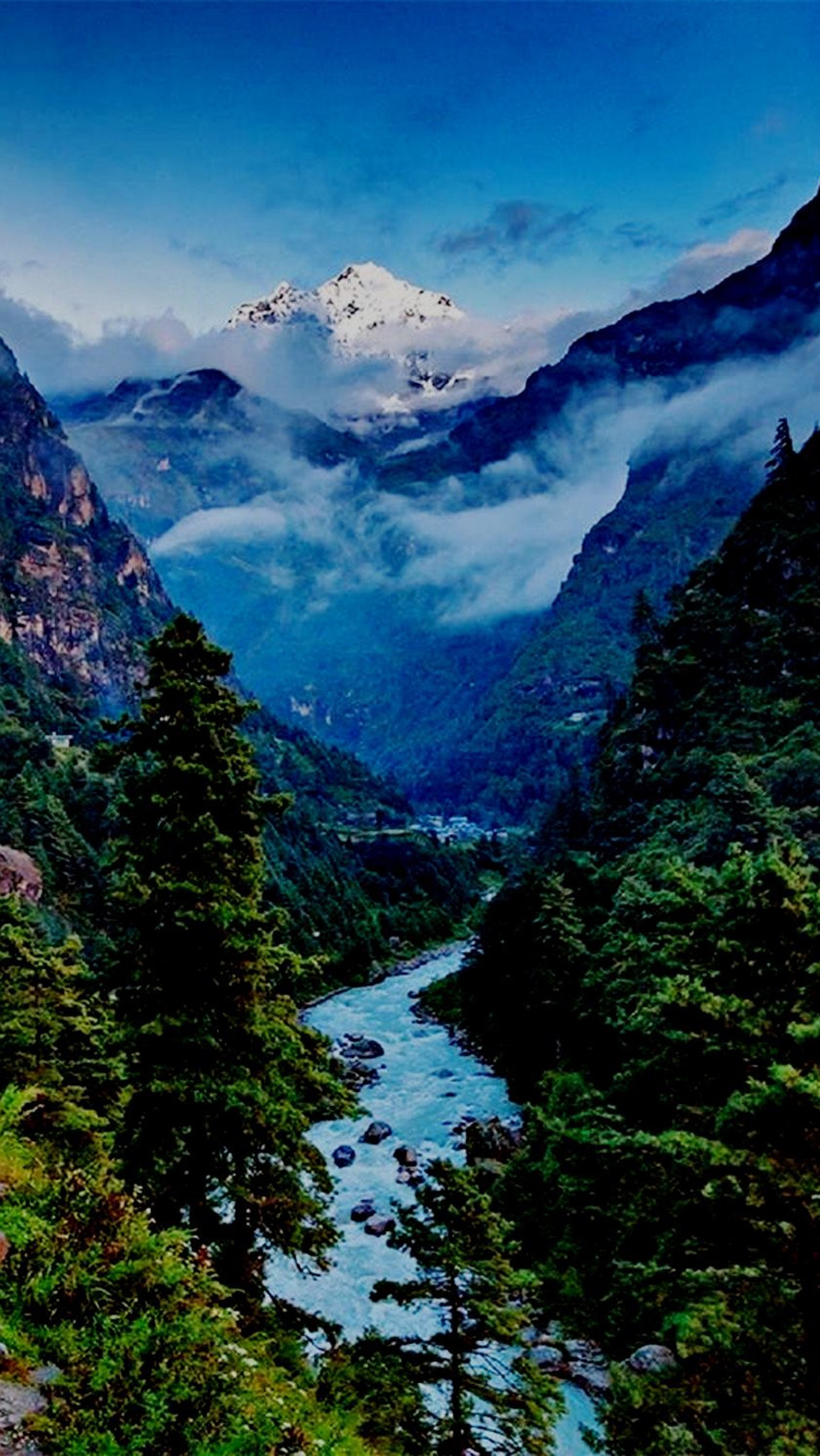 Mountains and a river in the distance with a mountain in the distance (mountain, nature, river, sky)