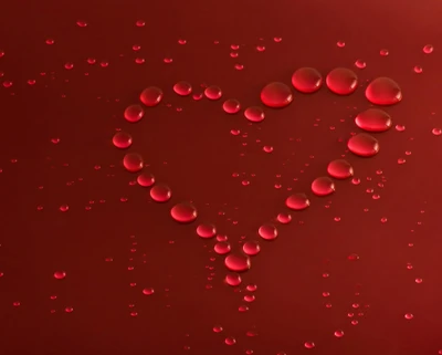 Heart-Shaped Raindrops on Red Surface