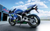 Sportbike Honda CBR1000RR mit Telefonica Movistar-Lackierung und Performance-Auspuffanlage.