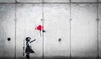 A monochromatic mural of a girl reaching for a red balloon on a textured concrete wall, symbolizing hope and dreams in street art.