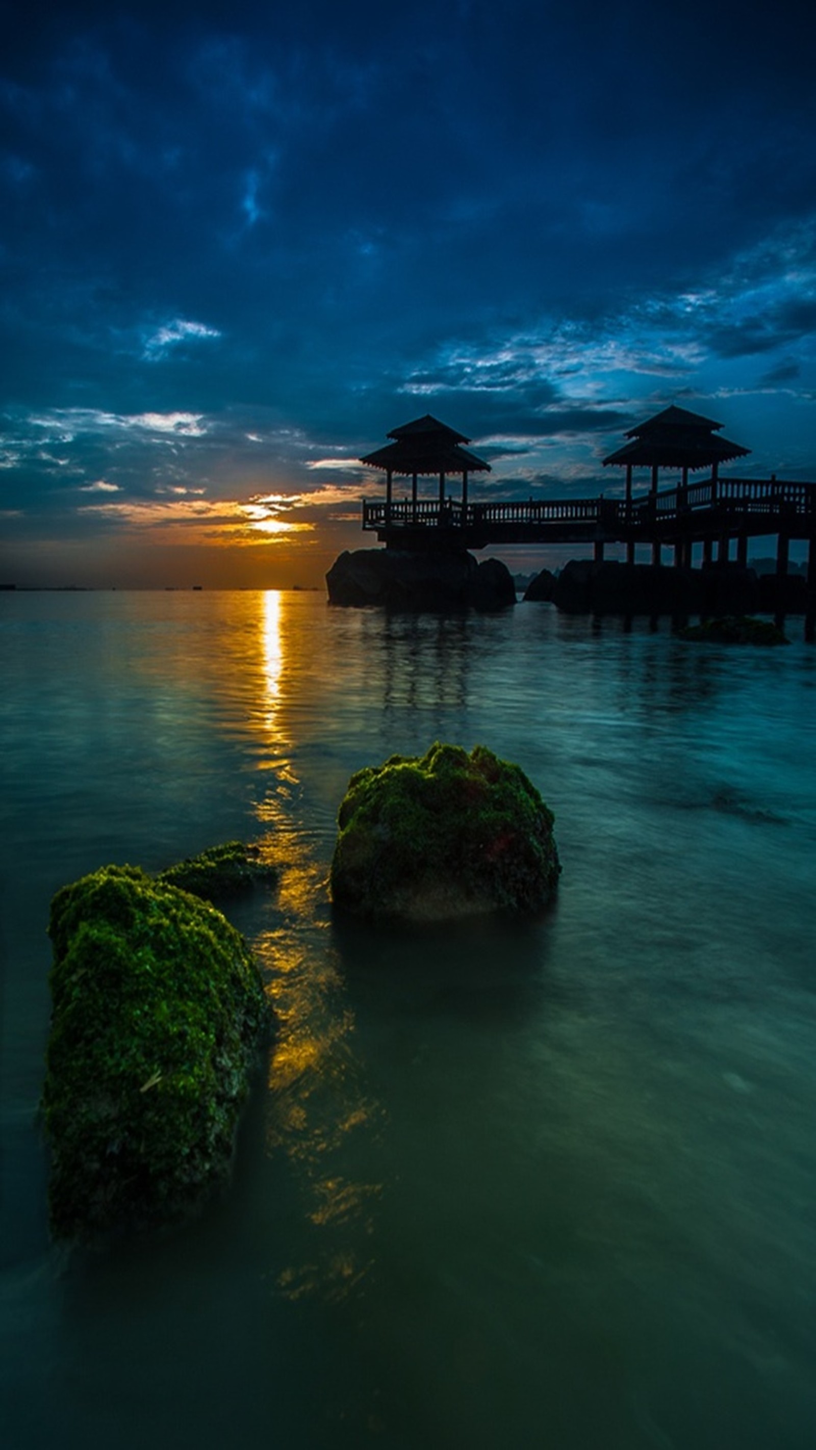 Arafed view of a pier with a gazebo and a body of water (landscape, nature)