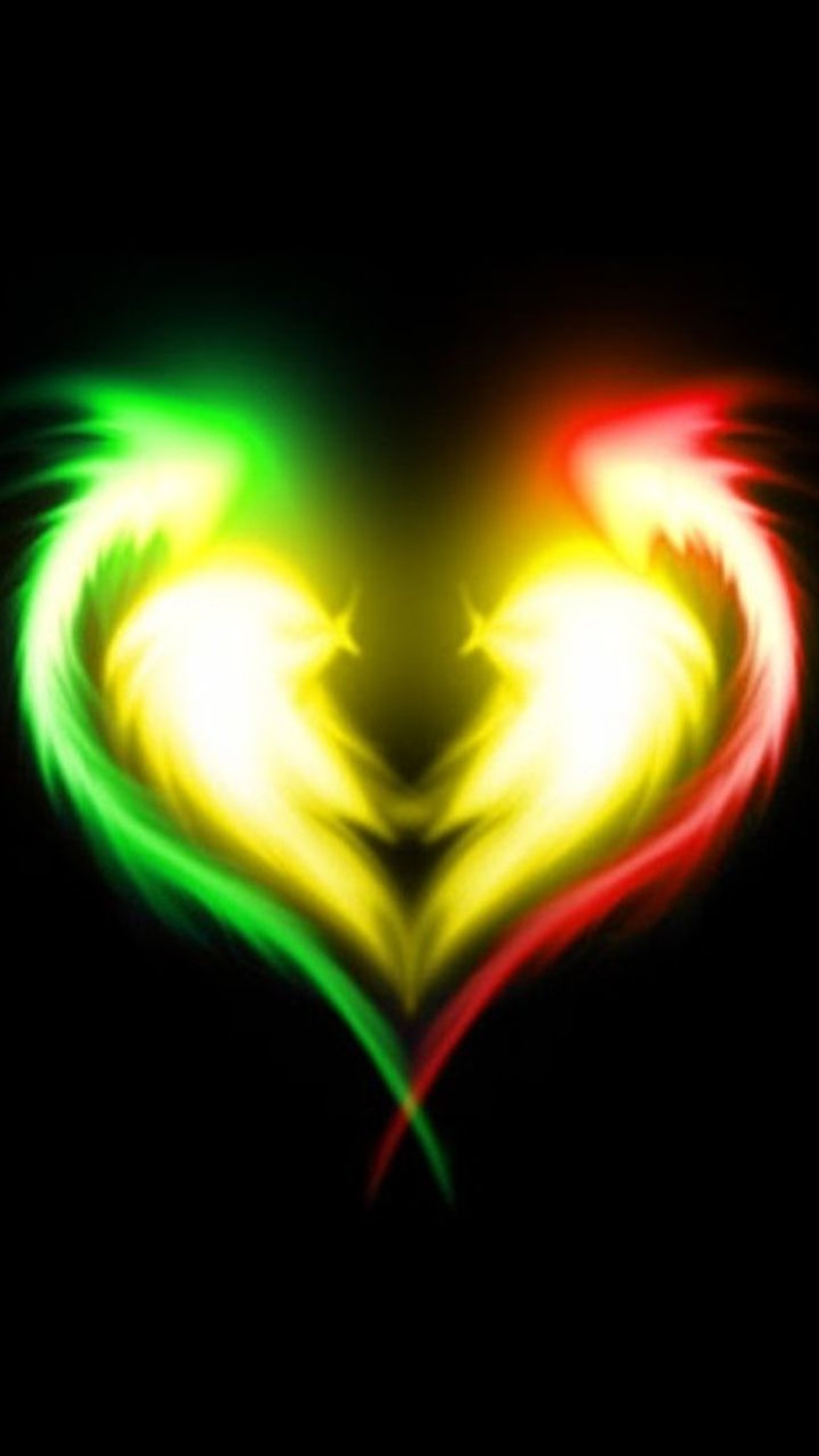 A heart shaped neon light in the dark with a black background (amor, corazon, heart, love, reggae)