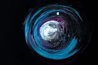 Vortex cosmique de liquides colorés dans un espace sombre