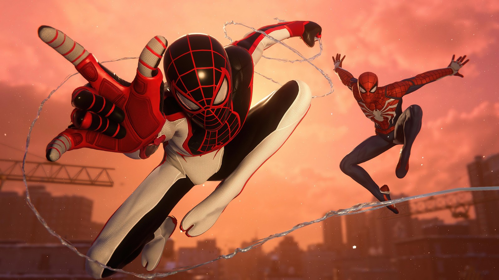 Spider-man saute par-dessus du fil barbelé dans une scène du jeu vidéo spider-man (marvels spider man miles morales, playstation 5, ps5, jeu vidéo, miles morales)