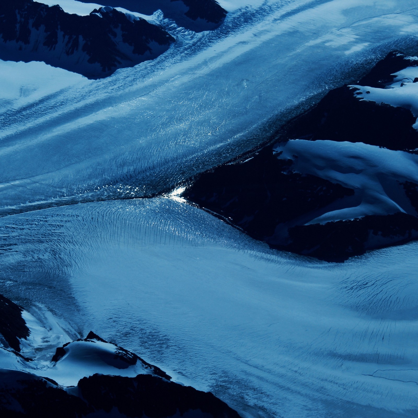 Arafed view of a mountain with a glacier and a small stream (blue, ice, water, ocean, sea)