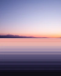 Serene Sunset Silhouette Over Mountain Reflections