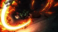 Tanjiro Kamado unleashes the Dance of the Fire God, wielding his katana amid swirling flames.