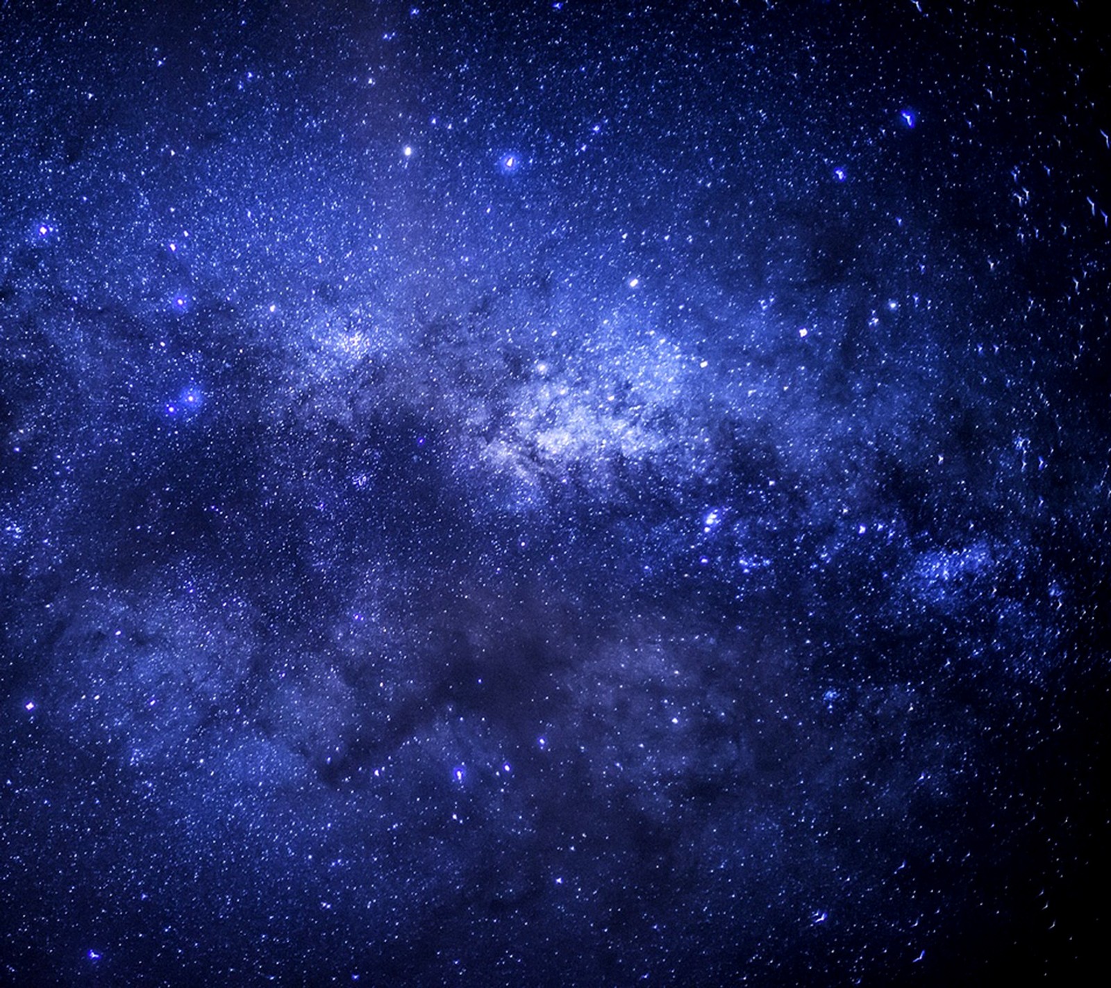 A close up of a blue galaxy with stars and a black background (night, sky, starry)