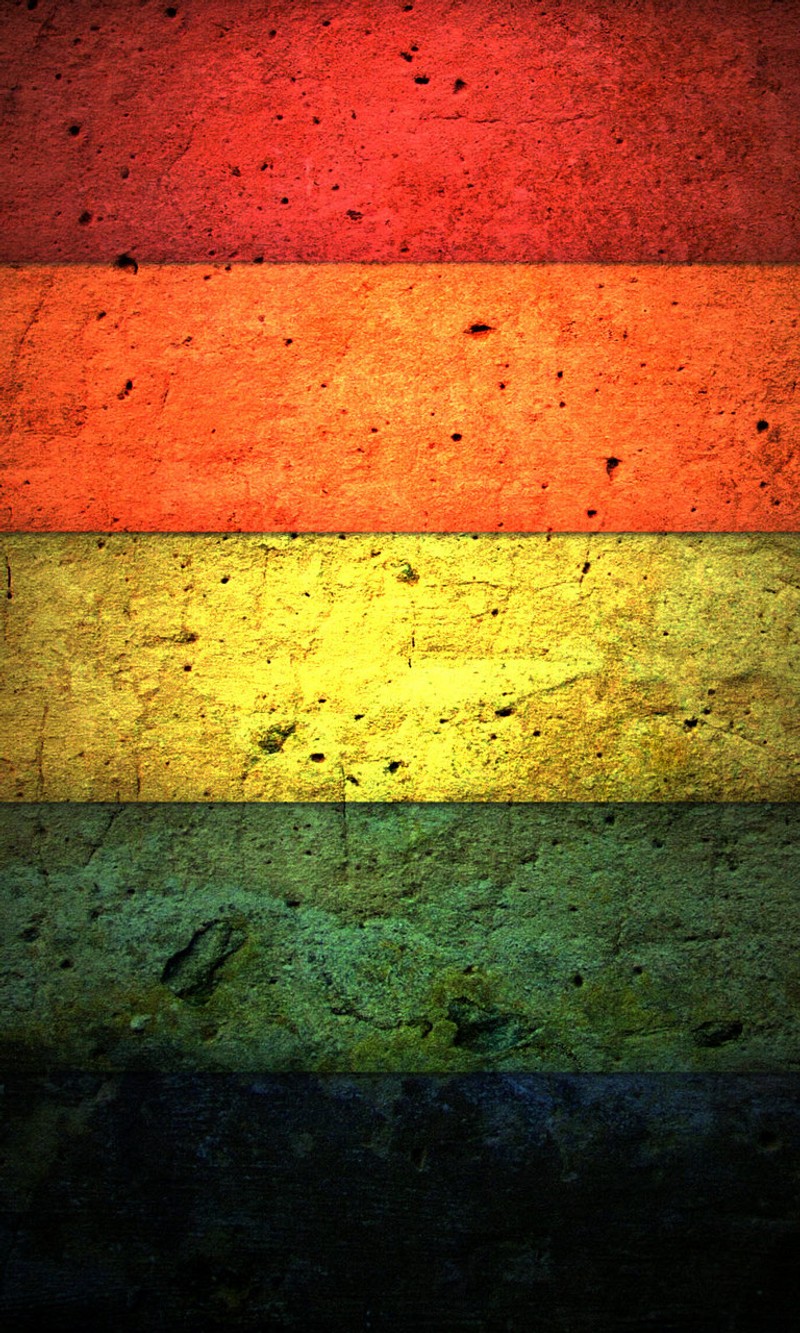 A close up of a wall with a rainbow painted on it (abstract, colors, strips)