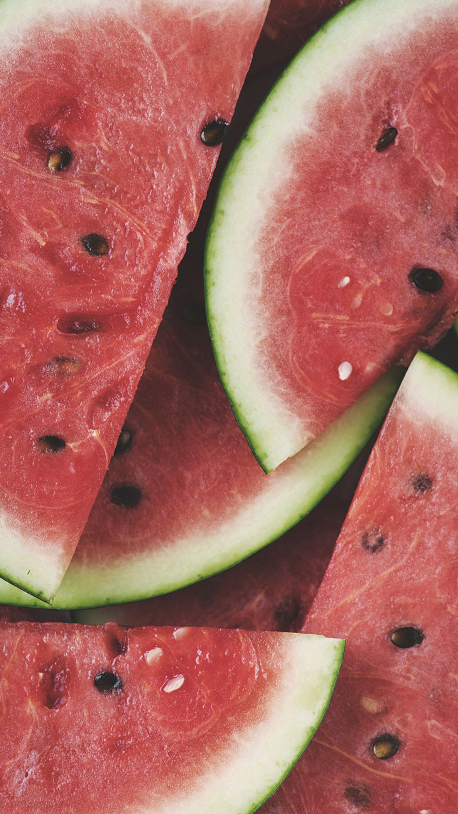 Slices of watermelon are arranged in a pattern on a table (food, watermelon, watermelons)