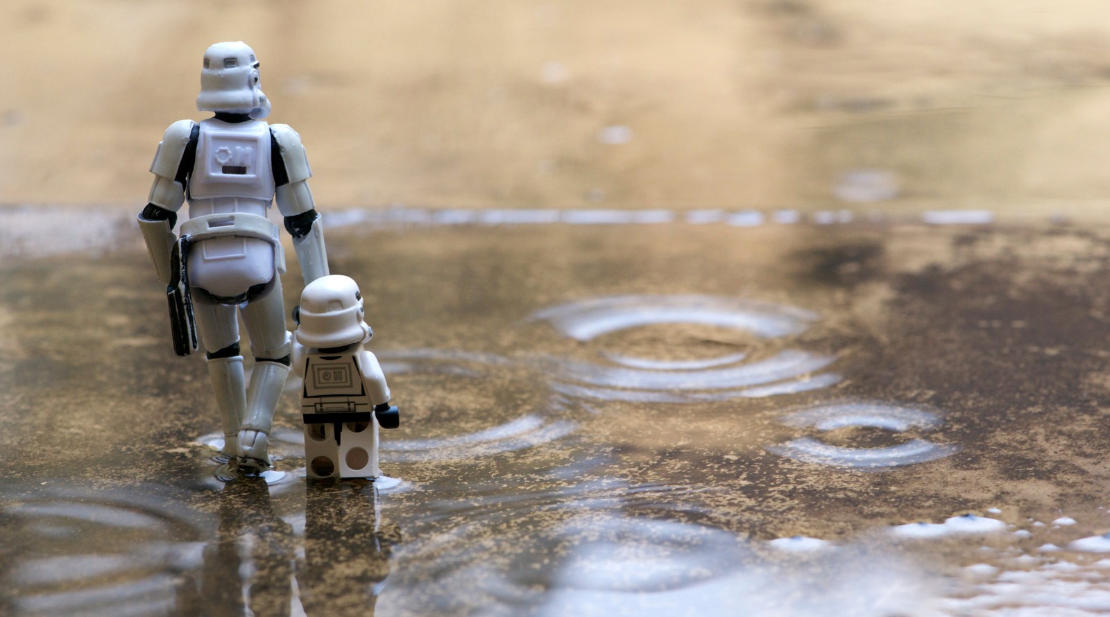 There is a toy figure that is standing in the water (luke skywalker, stormtrooper, star wars, lego star wars, water)