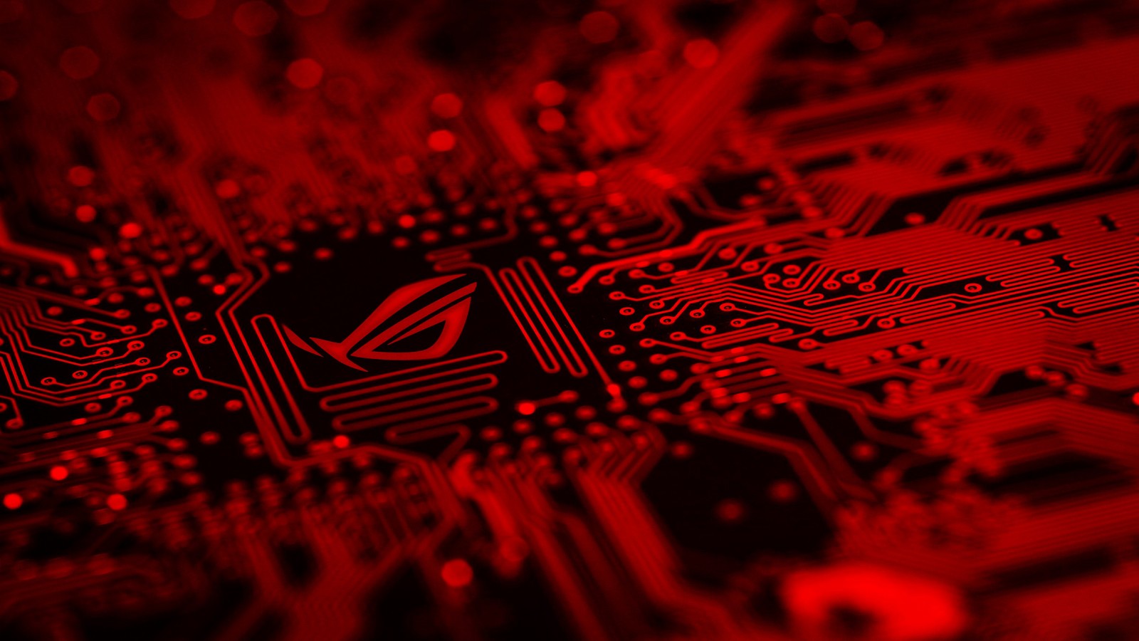 A close up of a red computer motherboard with a red light (red, electronics, pattern, design, technology)