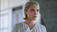 Princess Irulan in a delicate lace outfit from "Dune: Part Two" featuring Florence Pugh.