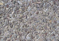 Textured surface of mixed gravel and stone, showcasing various colors and sizes of pebbles and rubble.